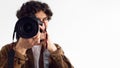 Close-up of male photographer with DSLR camera focusing intently Royalty Free Stock Photo