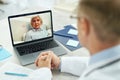 Nice old woman having online consultation with doctor Royalty Free Stock Photo