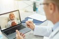 Smiling elderly woman having online consultation with doctor Royalty Free Stock Photo