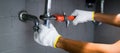 Close-up Of Male Plumber Fixing White Sink Pipe With Adjustable Wrench Royalty Free Stock Photo