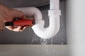 Plumber Fixing Sink Pipe With Adjustable Wrench Royalty Free Stock Photo
