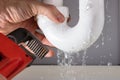 Plumber Fixing Sink Pipe With Adjustable Wrench Royalty Free Stock Photo