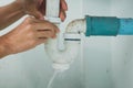 Close-up Of Male Plumber Fixing White Sink Pipe