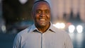 Close up male portrait in city outdoors African American adult middle-aged man posing on street happy smiling guy face Royalty Free Stock Photo