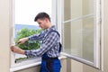 Repairman Fixing Window With Screwdriver Royalty Free Stock Photo