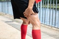Runner Holding His Injured Leg Royalty Free Stock Photo
