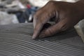 Close up of male sculptor making art on clay using hands. Clay master moulding. Clay modelling.