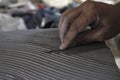 Close up of male sculptor making art on clay using hands. Clay master moulding. Clay modelling.