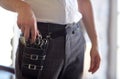 Close up of male stylist with tool case at salon