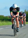 Close up of Male triathlete competitor on road cycling stage.