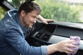 close-up male worker cleaning seat inside car Royalty Free Stock Photo