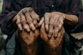 Close up of male wrinkled hands, old man is wearing Royalty Free Stock Photo