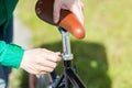 Close up of man adjusting fixed gear bike saddle Royalty Free Stock Photo