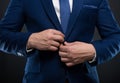 Close-up man adjusting his jacket button Royalty Free Stock Photo