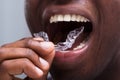 Man Adjusting Transparent Aligners In His Teeth Royalty Free Stock Photo