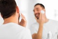 Close up of man applying shaving foam to face Royalty Free Stock Photo