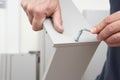 Close Up Of Man Assembling Flat Pack Furniture