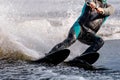 close-up man athlete riding waterskiing on lake