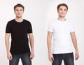 Close up of man in blank black and white t-shirt isolated on white background. Copy space and mock up.