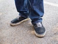 Close up a man in blue jeans standing on the floor Royalty Free Stock Photo