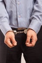 Close up of a man, businessman in handcuffs arrested Royalty Free Stock Photo