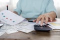 Close up of man with calculator counting money and making notes at home Royalty Free Stock Photo