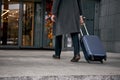 Close up of man carrying suitcase at the airport terminal Royalty Free Stock Photo