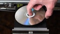 Close up of Man Changing Disks in DVD Player