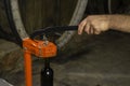 close-up of a man corking a bottle of wine at a winery . Royalty Free Stock Photo