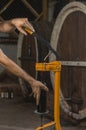 close-up of a man corking a bottle of wine at a winery . Royalty Free Stock Photo