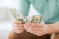 Close up of man counting money at home Royalty Free Stock Photo