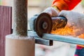 Man cutting steel with electric grinder tool Royalty Free Stock Photo