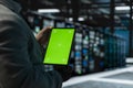 Close up of man in data center using green screen tablet Royalty Free Stock Photo