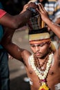 Close-up of man devotee carrying a pot of milk in Thaipusam Festival