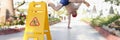 Man didnt notice yellow sign of wet floor plate near swimming pool