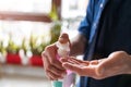 Man using hand sanitizer Royalty Free Stock Photo