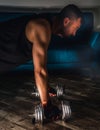 Close up of a man doing plank with metal dumbbells Royalty Free Stock Photo