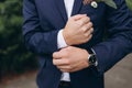 Close up of man dressing up and fastening buttons on shirt at home Royalty Free Stock Photo