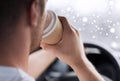 Close up of man drinking coffee while driving car Royalty Free Stock Photo