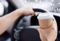 Close up of man drinking coffee while driving car Royalty Free Stock Photo