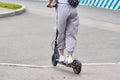 Close up of man driving on electric scooter in the city