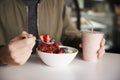 Close Up Of Man Eating Healthy Breakfast Of Granola In Cafe Royalty Free Stock Photo