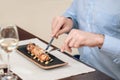 Close up of a man eating seafood at the restaurant