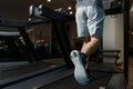 Close-Up Man Feet On Treadmill Royalty Free Stock Photo