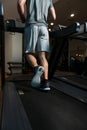 Close-Up Man Feet On Treadmill Royalty Free Stock Photo