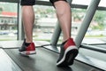 Close-Up Man Feet On Treadmill Royalty Free Stock Photo