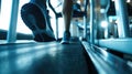 Close-up of man feet on a treadmill running at the gym