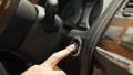 Close up for man finger pressing the car power start, stop button, transportation concept. Stock. Driver man hand