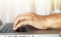 Close up man Finger using laptop keyboard Man working with laptop at home. man using laptop, searching online web browser Royalty Free Stock Photo