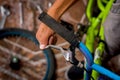 Close up of man fixing the handlebar of the bicycle, in a workshop Royalty Free Stock Photo
